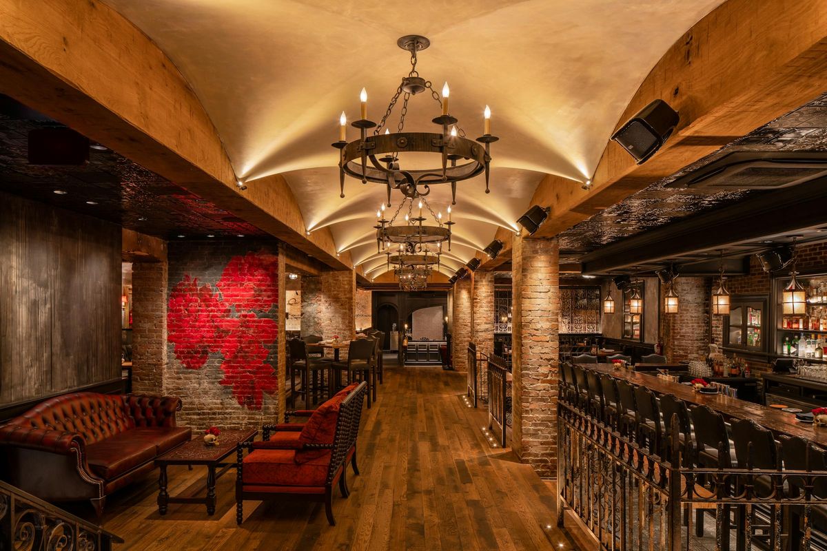 The candlelit main dining room at Lolita Back Bay