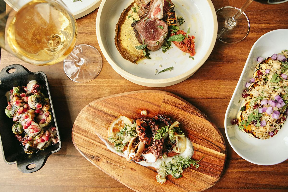 Shared plates at Moona: grilled octopus, lamb chops and Brussels sprouts with pomegranate
