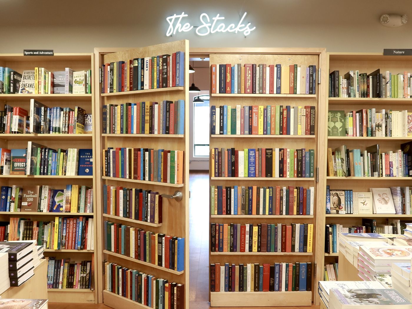 The Stacks at Trident Booksellers & Cafe: a hidden bookshelf door between walls of books